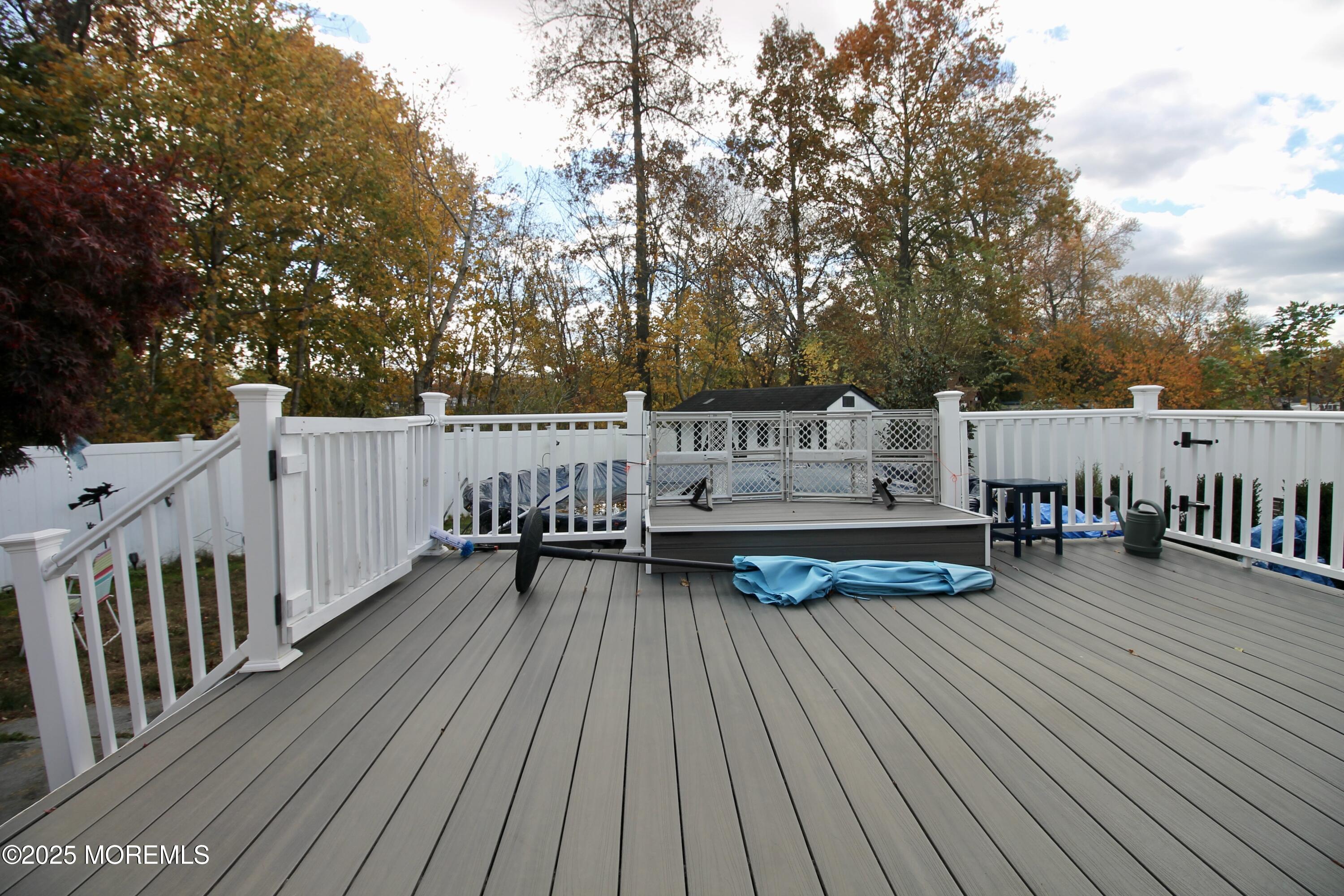 16 Maple Lane Howell, NJ 07731 - Photo 39 of 55 a view of deck with patio and wooden floor
