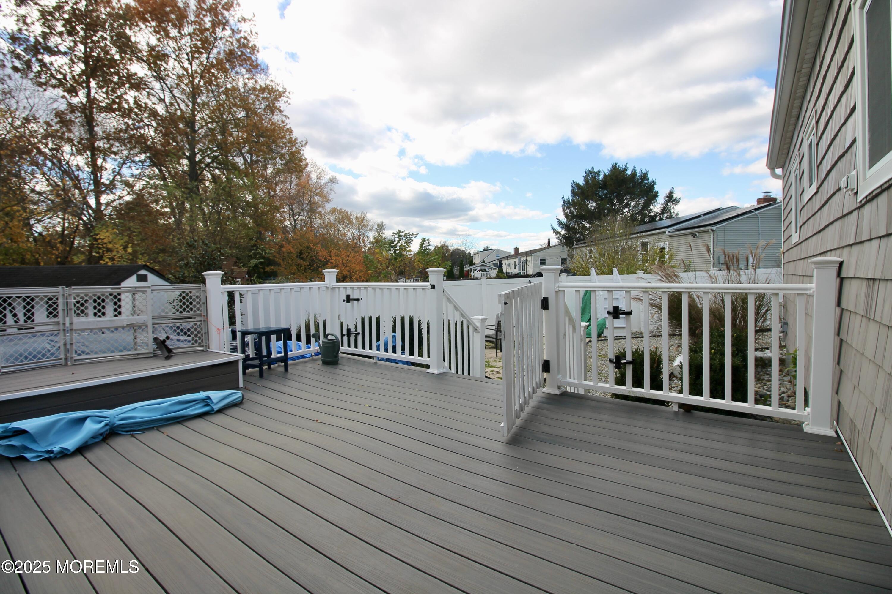 16 Maple Lane Howell, NJ 07731 - Photo 40 of 55 a view of a deck with wooden floor and fence