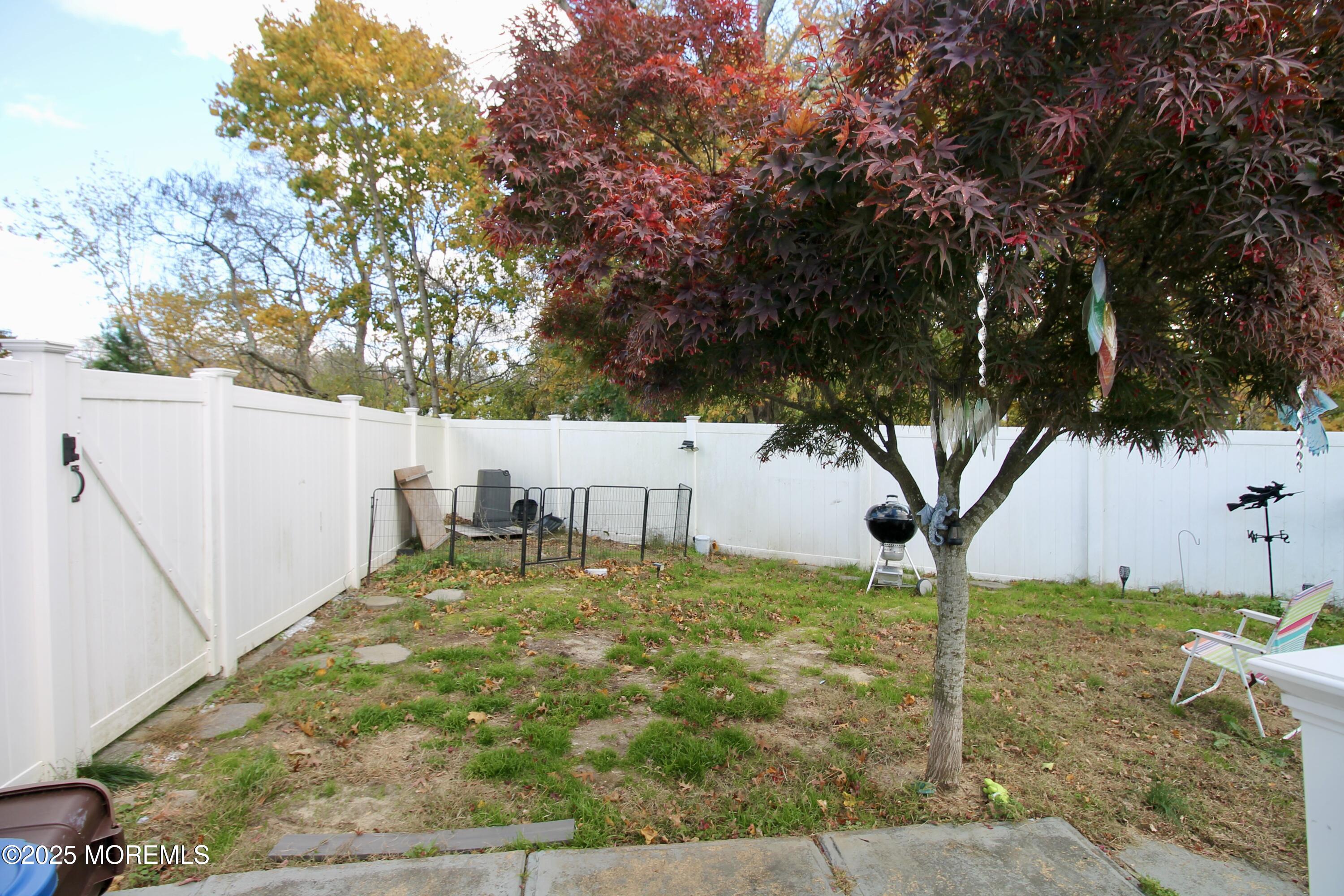 16 Maple Lane Howell, NJ 07731 - Photo 42 of 55 a backyard of a house with table and chairs