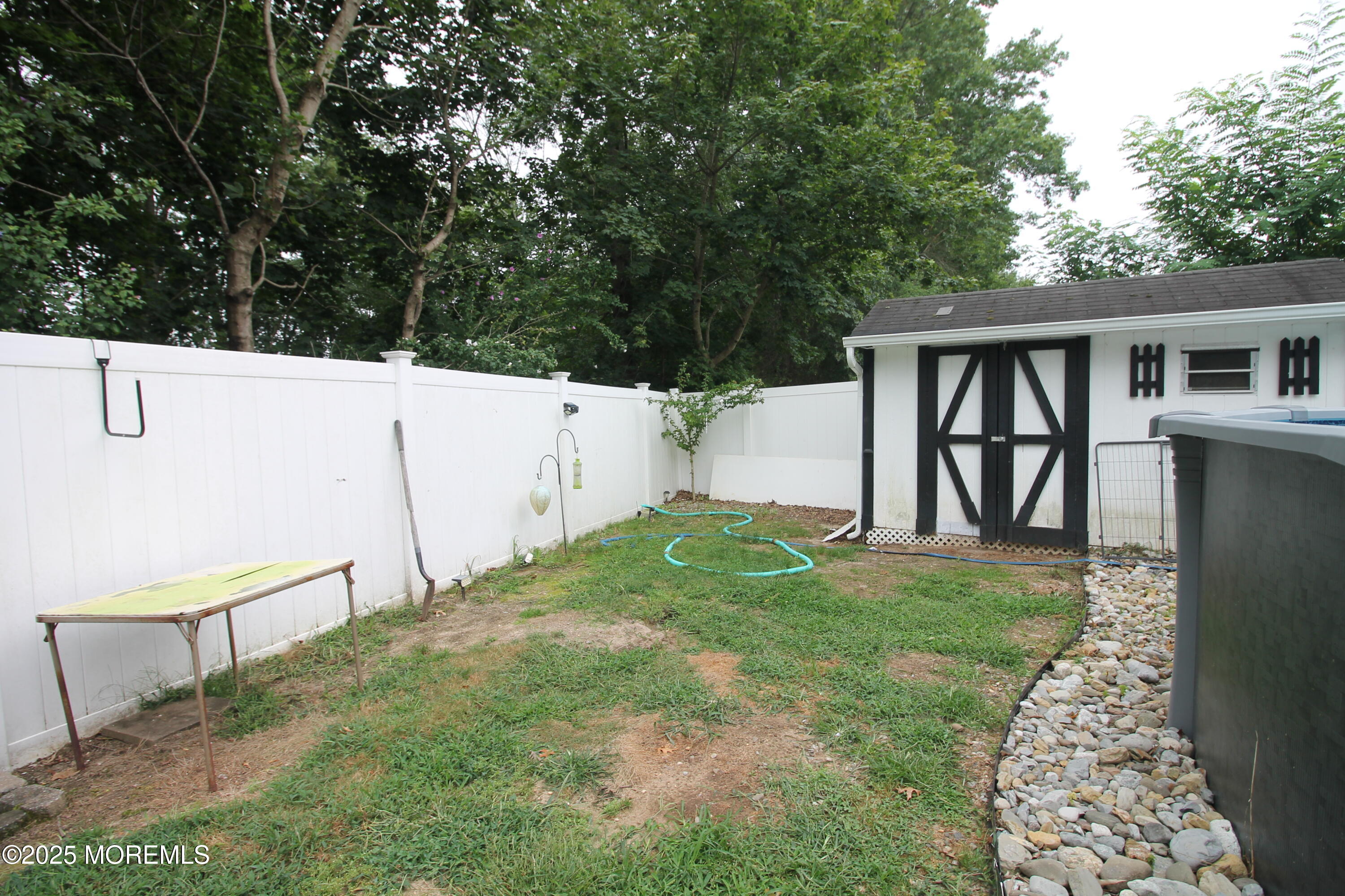 16 Maple Lane Howell, NJ 07731 - Photo 46 of 55 a view front of house with backyard and trees