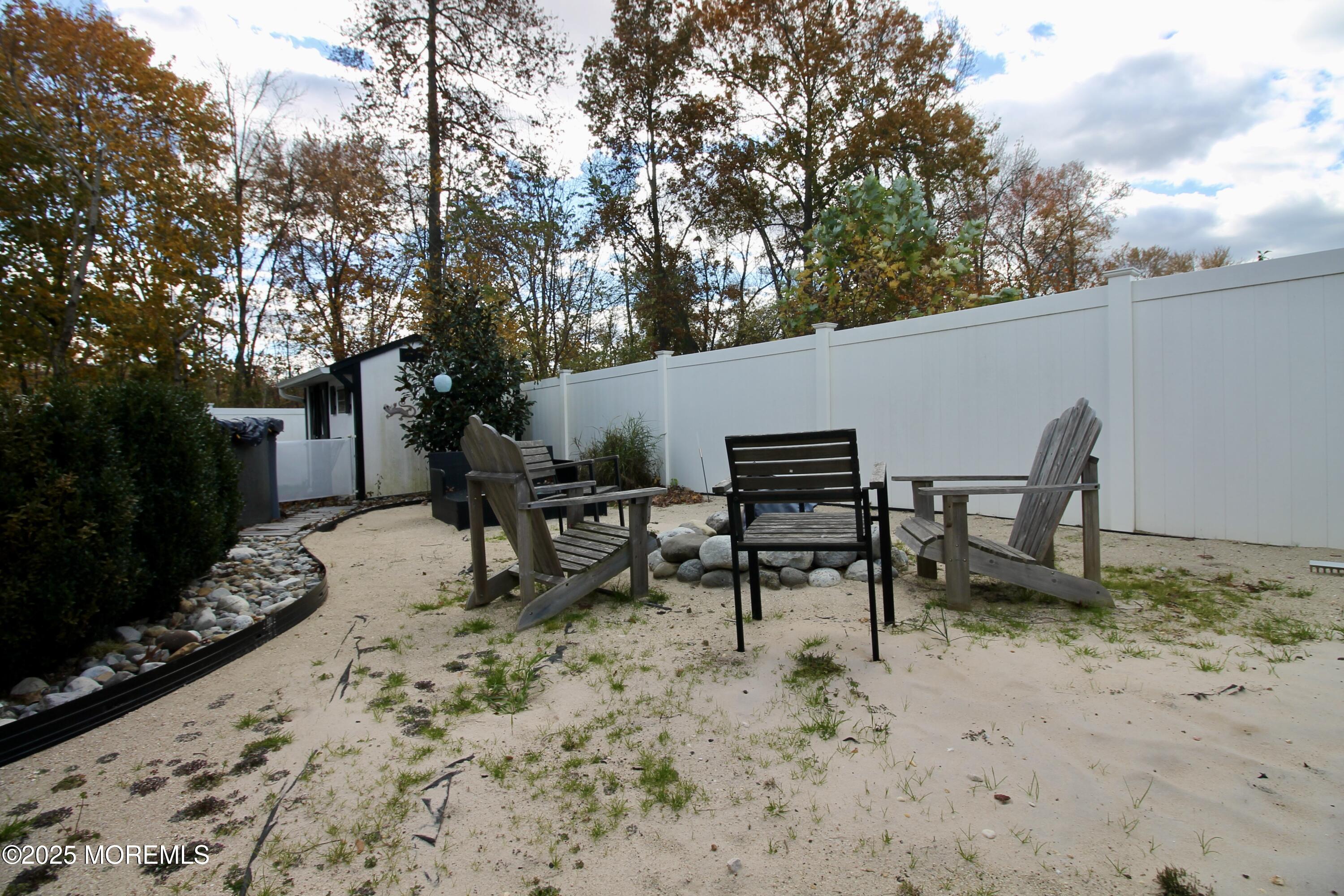16 Maple Lane Howell, NJ 07731 - Photo 48 of 55 a backyard of a house with table and chairs