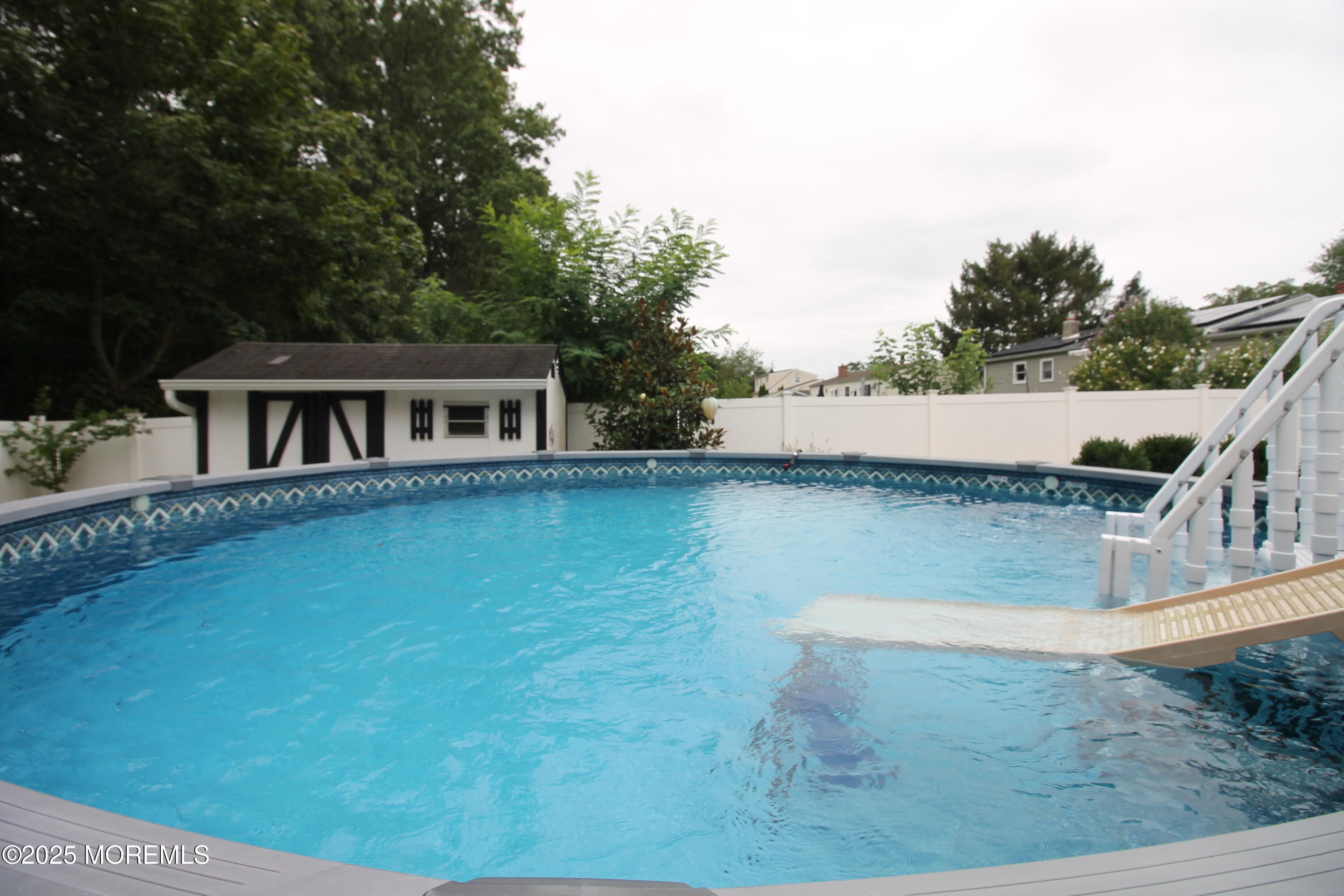 16 Maple Lane Howell, NJ 07731 - Photo 55 of 55 a view of a house with pool and a yard