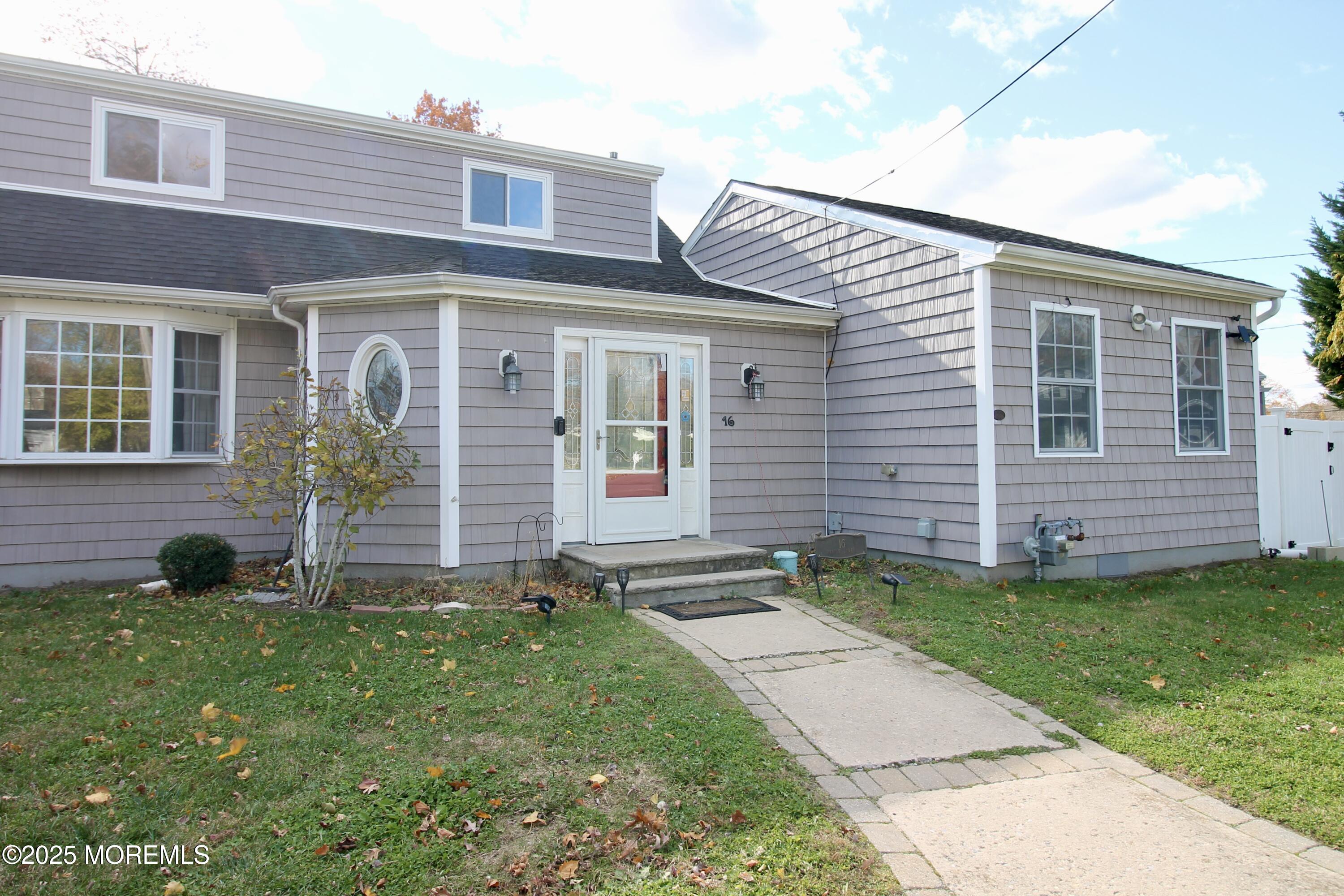16 Maple Lane Howell, NJ 07731 - Photo 6 of 55 a front view of a house with a garden