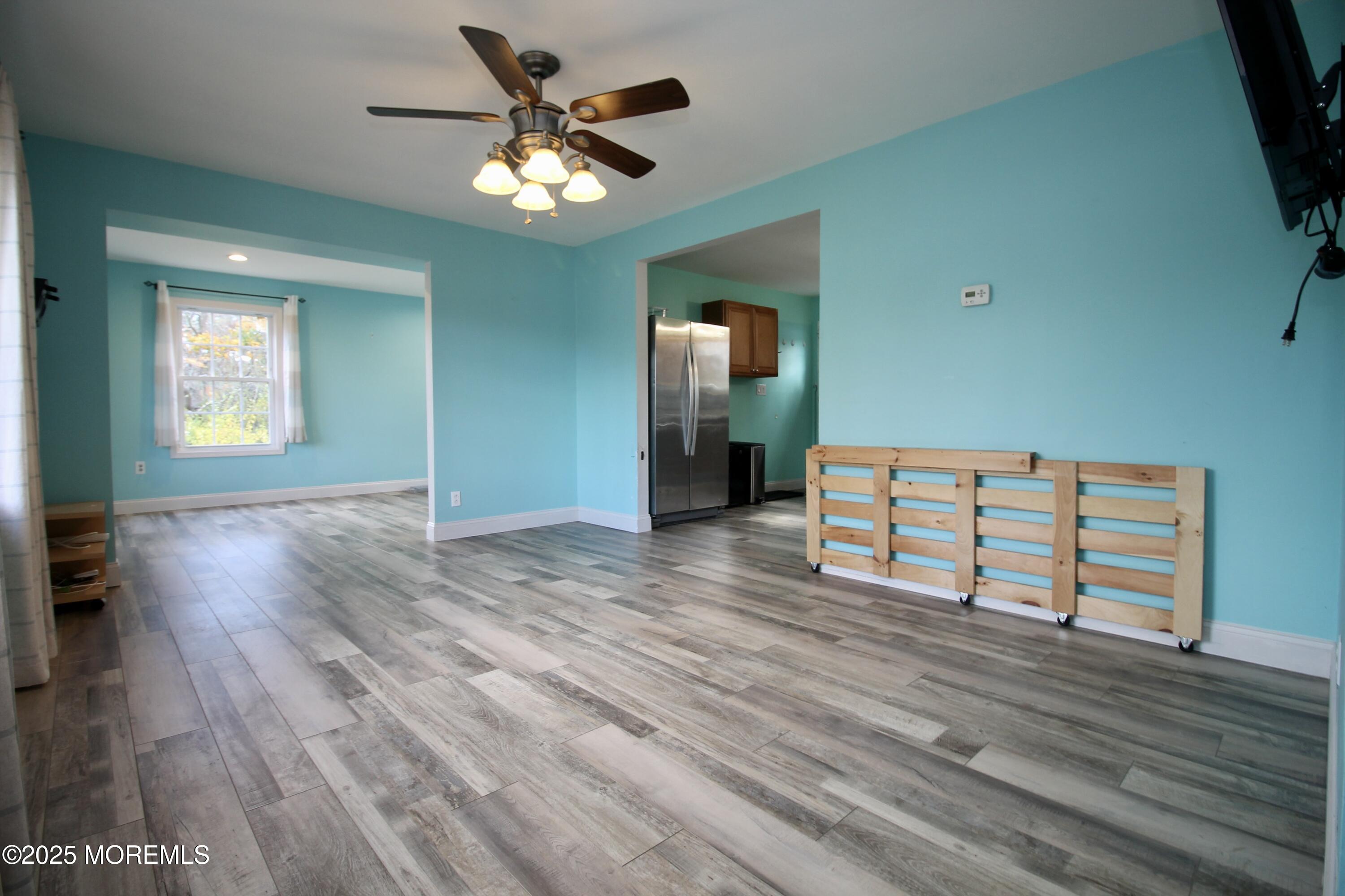 16 Maple Lane Howell, NJ 07731 - Photo 10 of 55 wooden floor and windows in a room