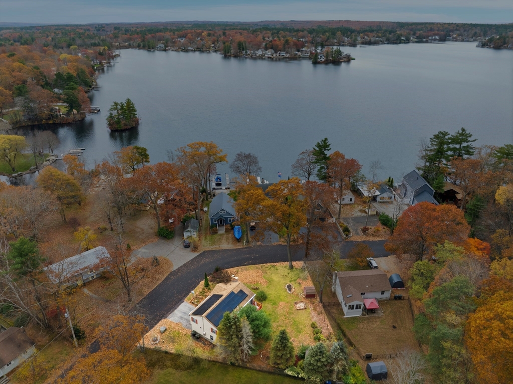 an aerial view of a house with a lake view