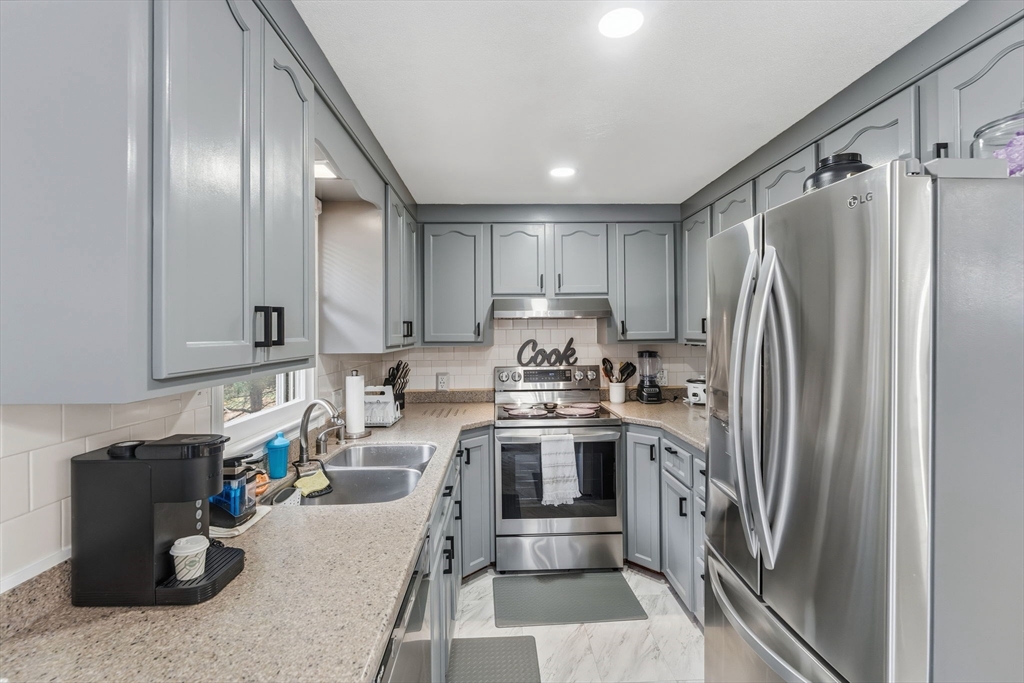 26 Wakefield Avenue Webster, MA 01570 - Photo 13 of 42 a kitchen with a refrigerator and a sink