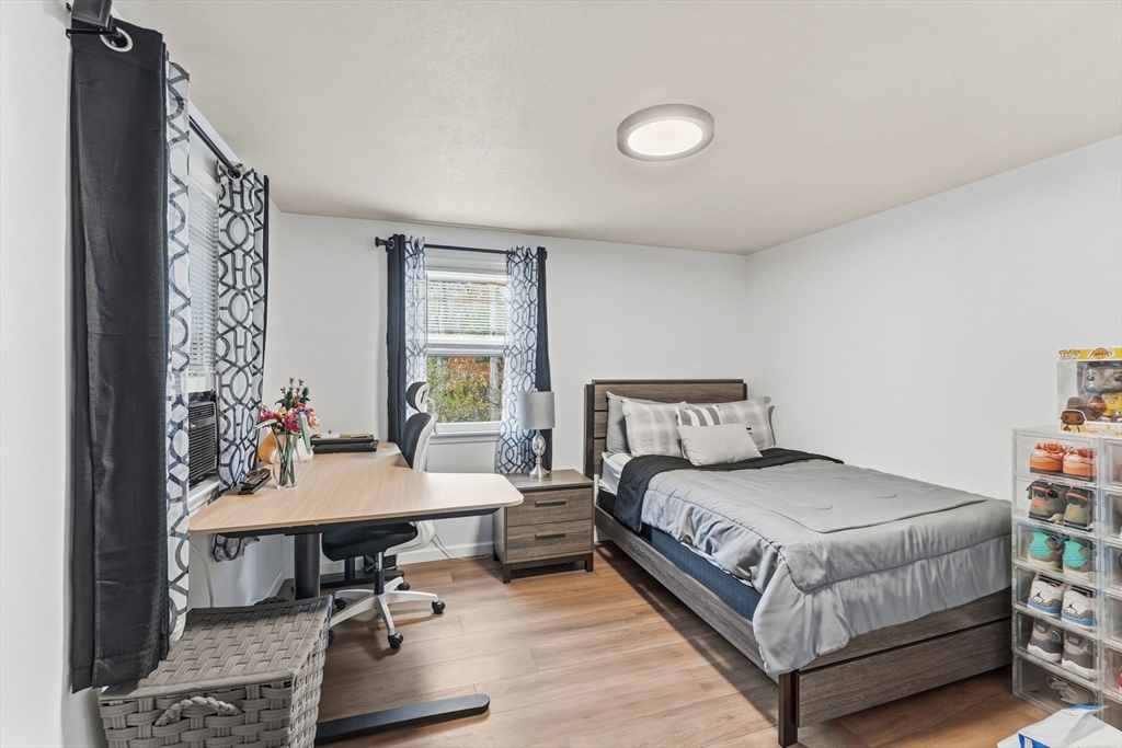 26 Wakefield Avenue Webster, MA 01570 - Photo 18 of 42 a bedroom with a bed and a table