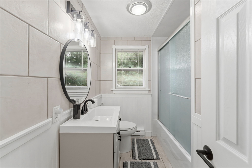 26 Wakefield Avenue Webster, MA 01570 - Photo 20 of 42 a bathroom with a sink toilet and a mirror