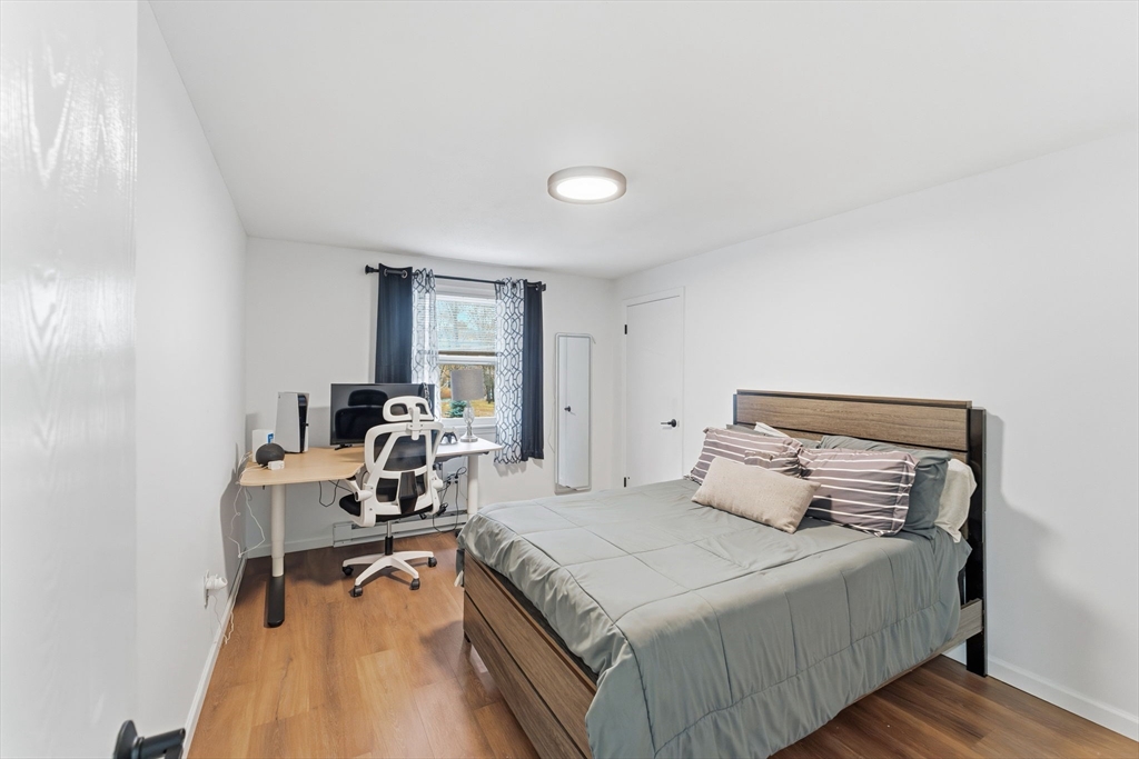 26 Wakefield Avenue Webster, MA 01570 - Photo 22 of 42 a bedroom with a bed and a table