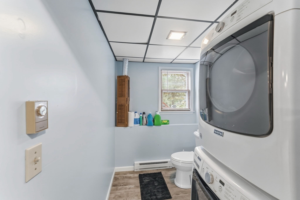 26 Wakefield Avenue Webster, MA 01570 - Photo 31 of 42 a bathroom with a toilet sink and mirror