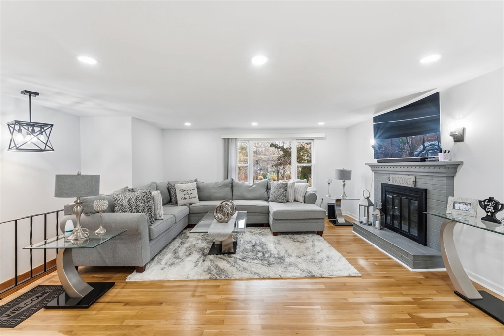 26 Wakefield Avenue Webster, MA 01570 - Photo 8 of 42 a living room with furniture and a fireplace