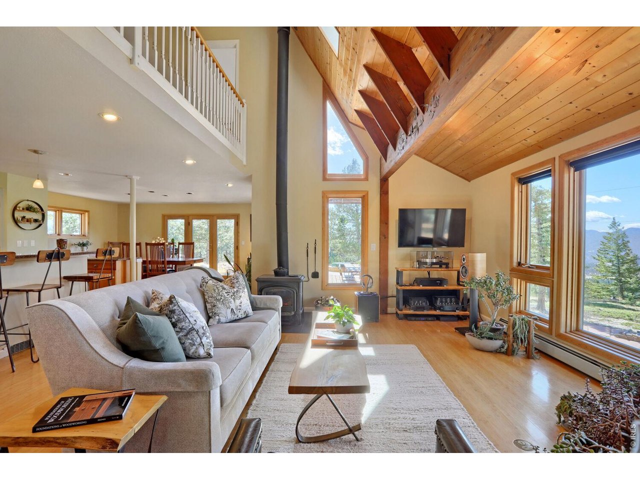 6010 Flagstaff Road Boulder, CO 80302 - Photo 8 of 41 Large upgraded wood windows frame mountain and forest views in every direction