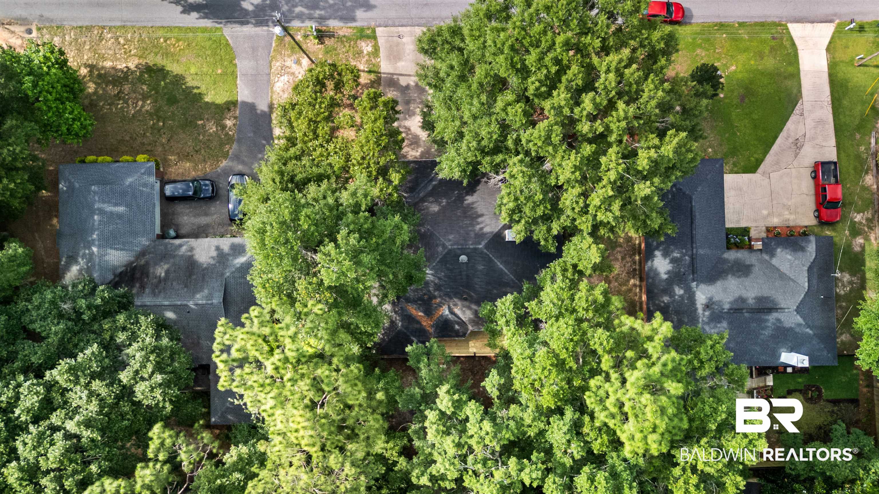 153 Lakeview Loop Daphne, AL 36526 - Photo 56 of 56 An aerial perspective highlights the home's established surroundings, generous tree coverage, and inviting neighborhood setting.