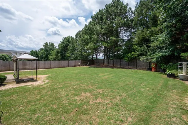a view of a backyard with a small cabin