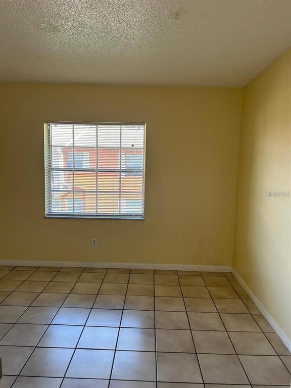 1627 West Oak Ridge Road, Unit D Orlando, FL 32809 - Photo 11 of 17 a view of a room with windows