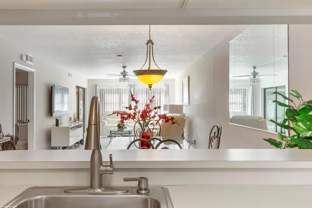 a bedroom with furniture and a chandelier