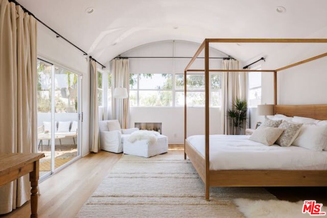 1523 Cabrillo Avenue Venice, CA 90291 - Photo 11 of 22 a bedroom with a large bed and a large window