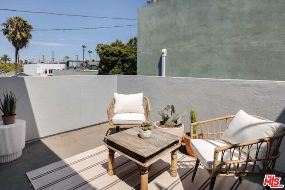 1523 Cabrillo Avenue Venice, CA 90291 - Photo 15 of 22 a living room with a table and chairs