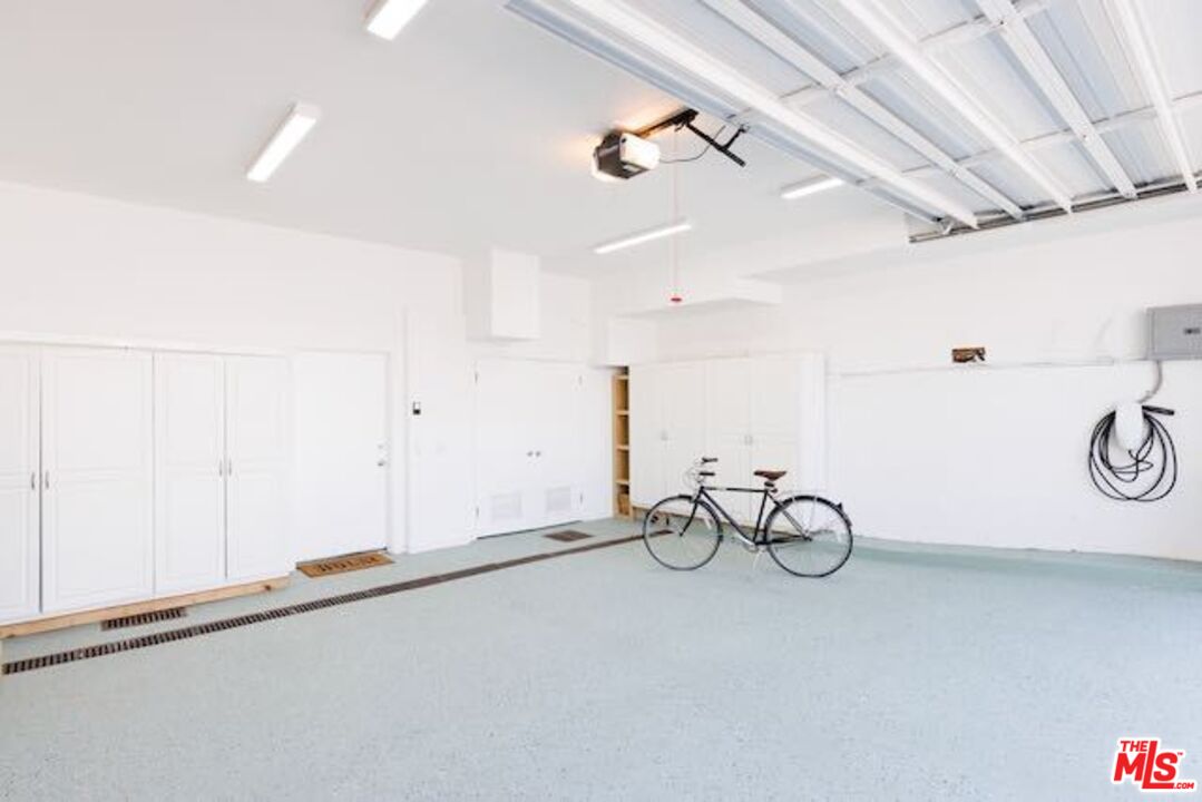 1523 Cabrillo Avenue Venice, CA 90291 - Photo 22 of 22 a view of a bike storage and utility room with racks on the wall