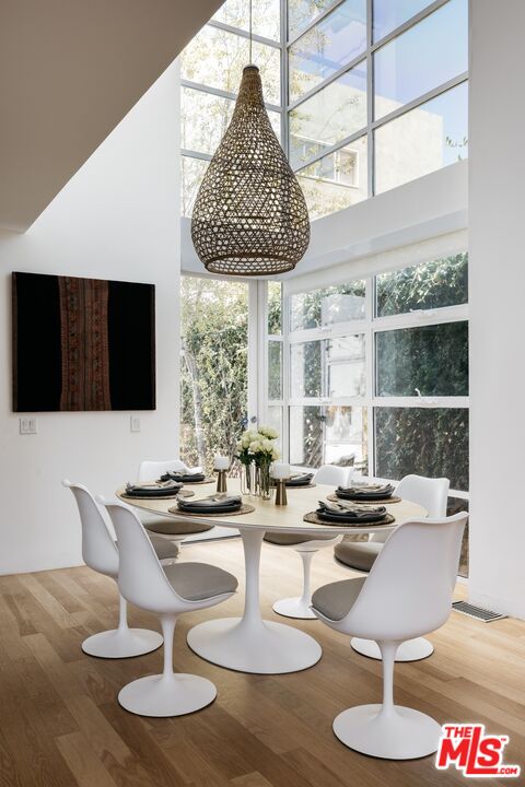 1523 Cabrillo Avenue Venice, CA 90291 - Photo 6 of 22 a dining room with furniture and a flat screen tv