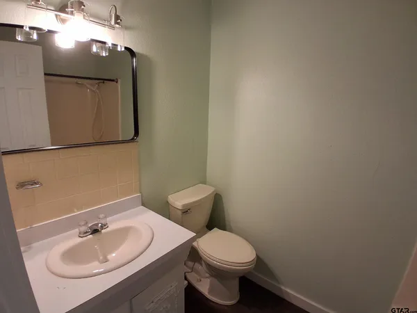 a bathroom with a shower and a bath tub