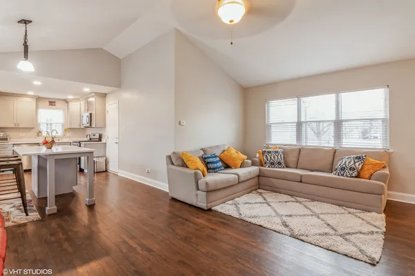 a kitchen with stainless steel appliances granite countertop a refrigerator stove and microwave