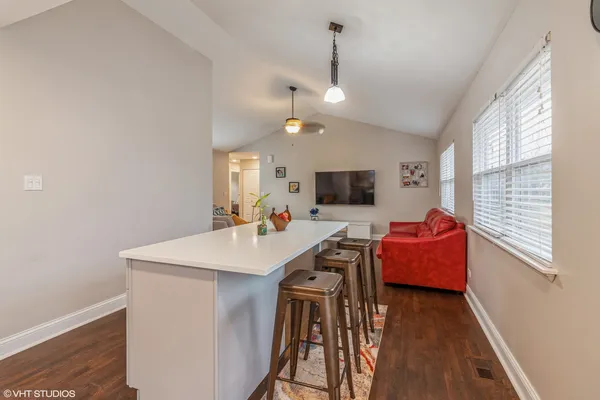 a view of a livingroom with furniture and hardwood floor