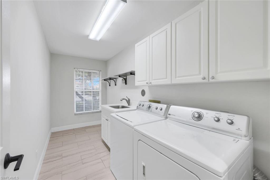 123 Napa Ridge Way Naples, FL 34119 - Photo 21 of 30 a utility room with dryer and washer