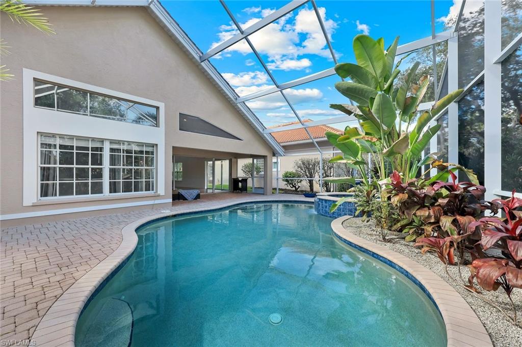 123 Napa Ridge Way Naples, FL 34119 - Photo 23 of 30 a view of a house with swimming pool yard and sitting area