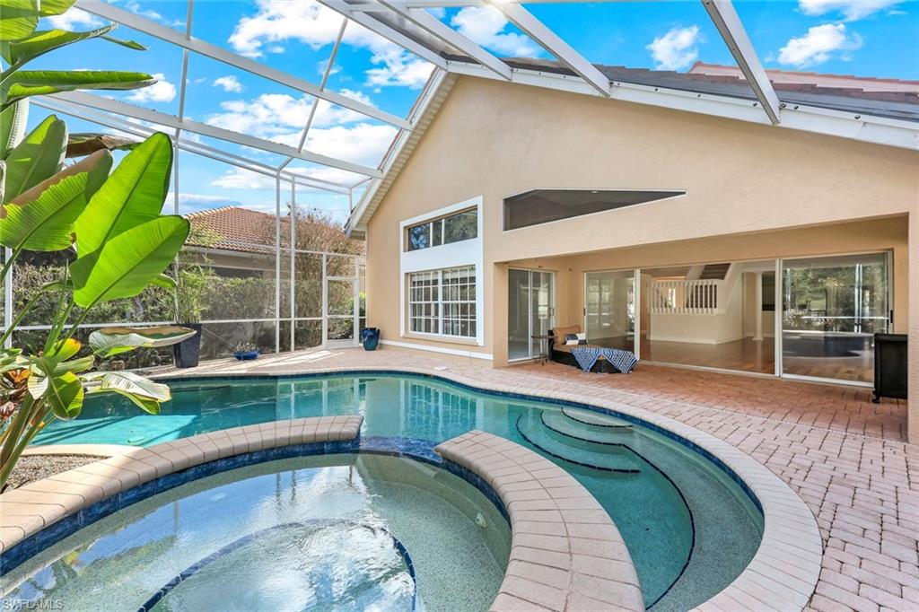 123 Napa Ridge Way Naples, FL 34119 - Photo 25 of 30 a swimming pool with outdoor seating and yard