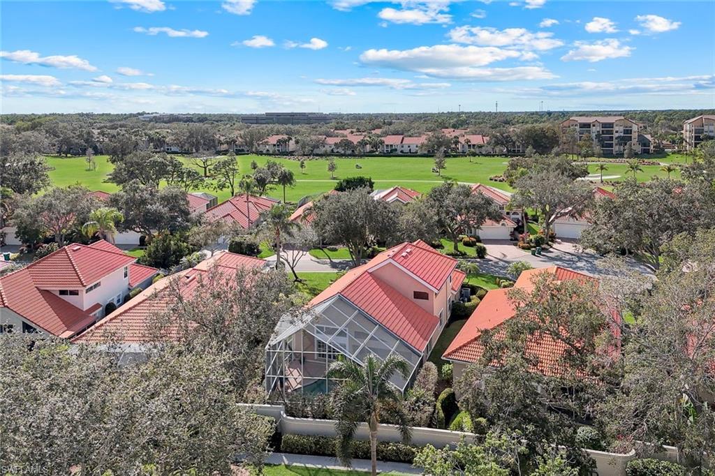 123 Napa Ridge Way Naples, FL 34119 - Photo 29 of 30 an aerial view of a house with a yard