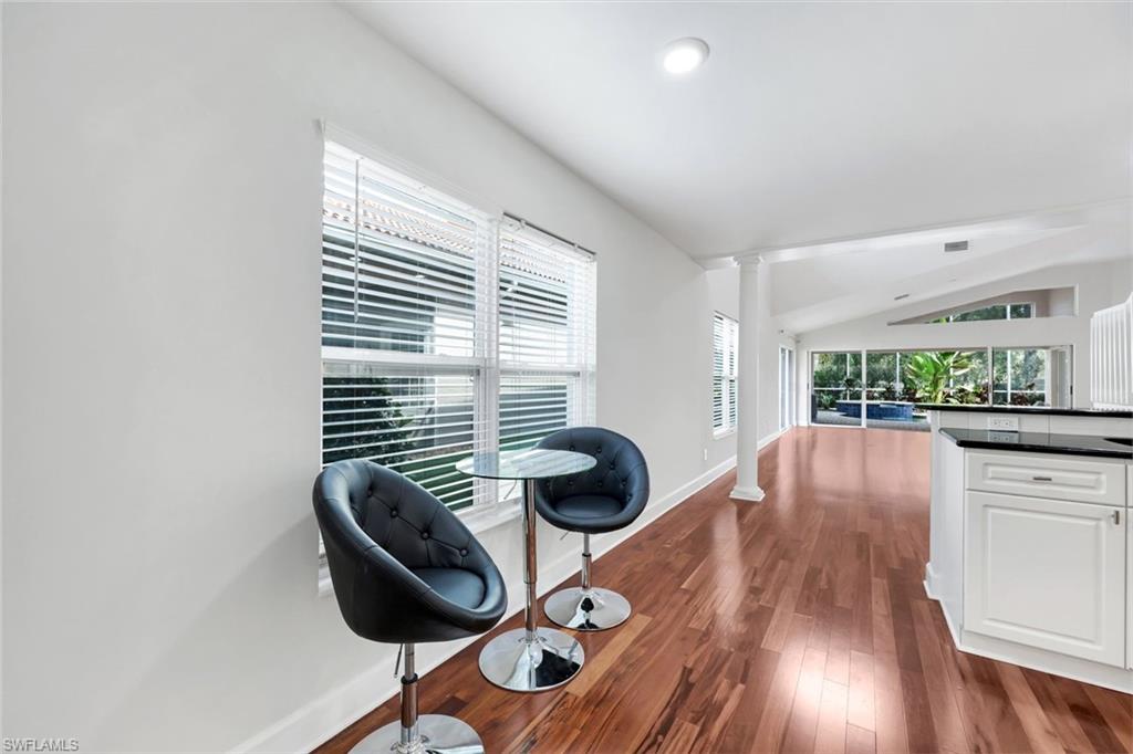 123 Napa Ridge Way Naples, FL 34119 - Photo 6 of 30 a dining room with furniture and wooden floor