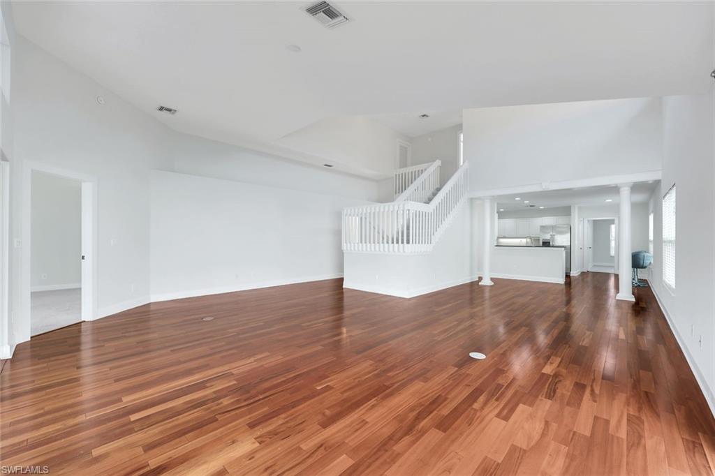 123 Napa Ridge Way Naples, FL 34119 - Photo 10 of 30 a view of empty room with wooden floor