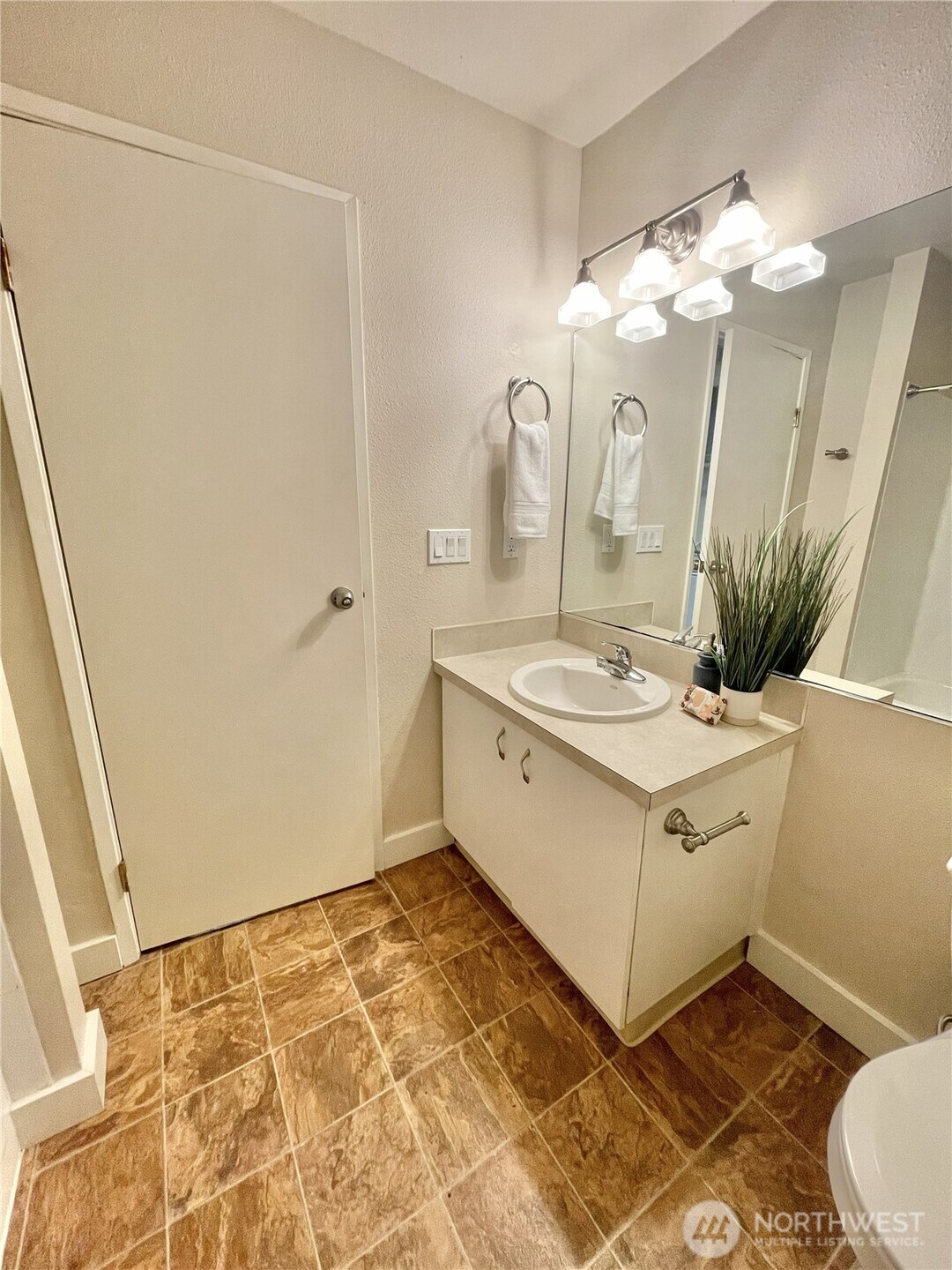 5300 Harbour Pointe Boulevard, Unit 311H Mukilteo, WA 98275 - Photo 19 of 27 a bathroom with a sink vanity granite and a mirror