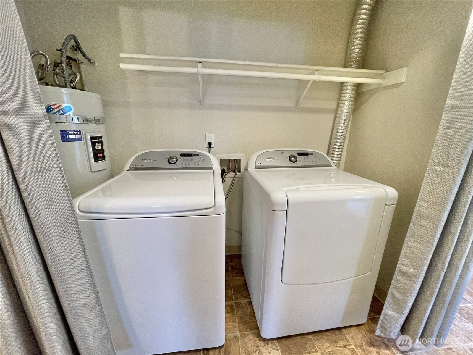 5300 Harbour Pointe Boulevard, Unit 311H Mukilteo, WA 98275 - Photo 21 of 27 a utility room with dryer and washer