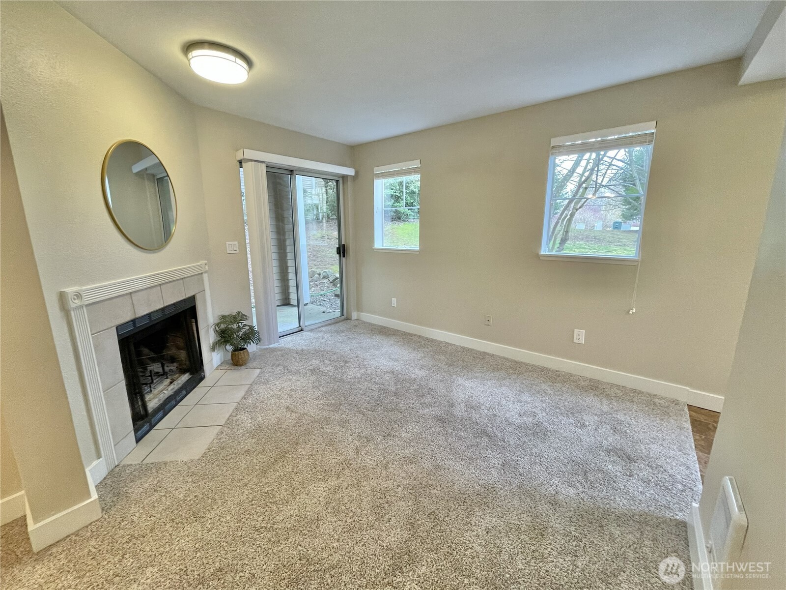5300 Harbour Pointe Boulevard, Unit 311H Mukilteo, WA 98275 - Photo 3 of 27 a view of an empty room with a fireplace and a window