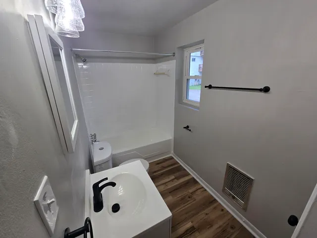 a bathroom with a sink and vanity
