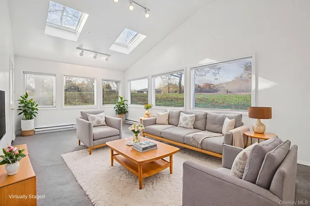 a view of a livingroom with furniture and window