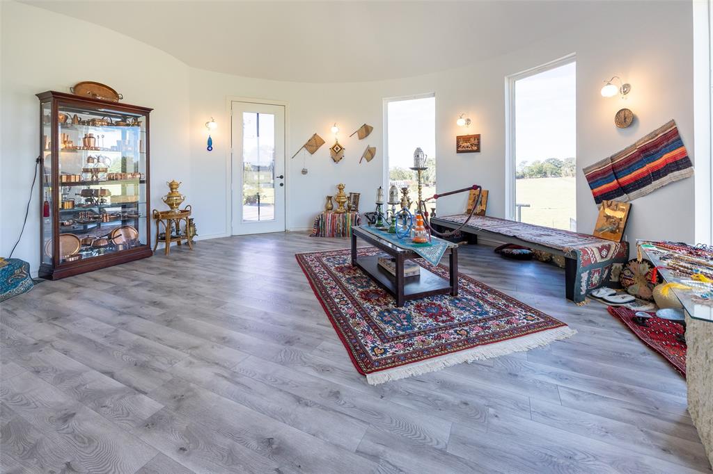 2630 Rockhill Road Aubrey, TX 76227 - Photo 28 of 36 a living room with furniture and a wooden floor