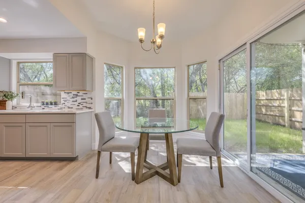 a view of a dining room with furniture window and wooden floor