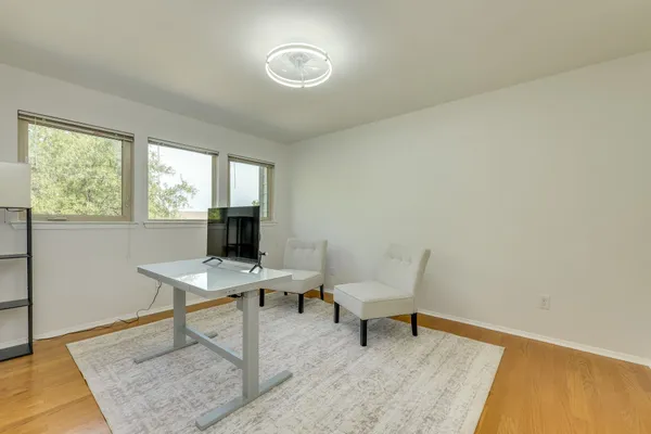 a workspace with furniture and a window