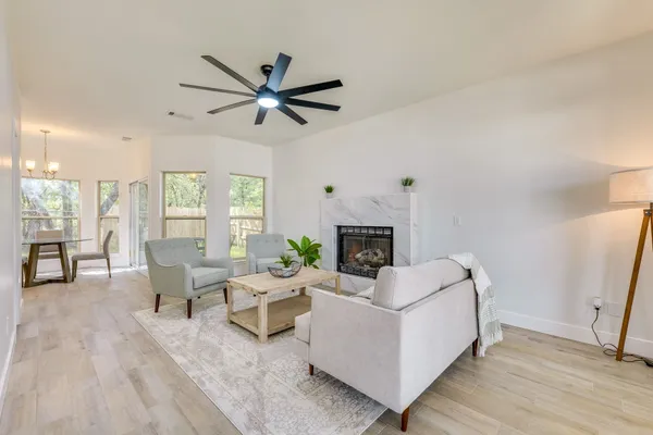 a living room with furniture and a fireplace