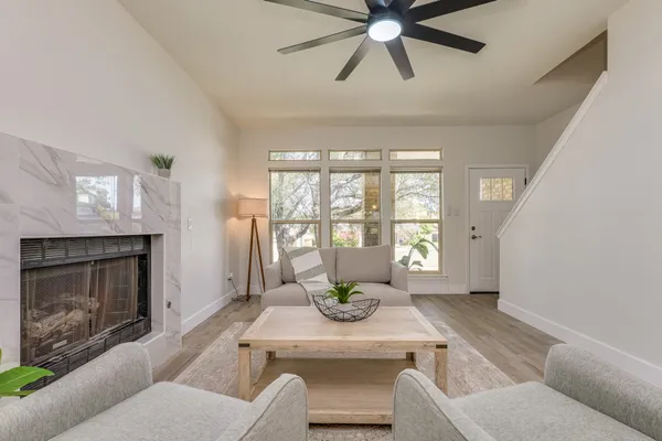 a living room with furniture and a fireplace