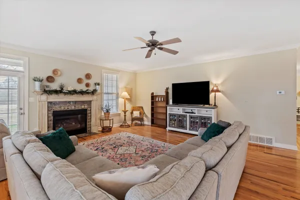a spacious bedroom with a bed and a dresser