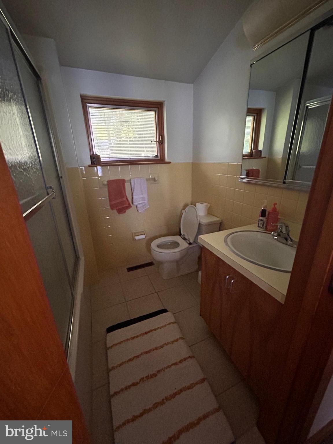 8204 Brookside Road Elkins Park, PA 19027 - Photo 8 of 20 a bathroom with a toilet sink and mirror