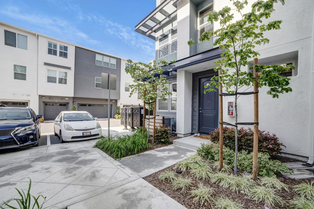 611 Clover Circle Milpitas, CA 95035 - Photo 4 of 30 a car parked in front of a brick house