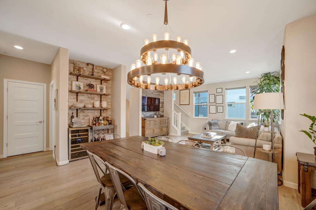 611 Clover Circle Milpitas, CA 95035 - Photo 10 of 30 a view of a dining room with furniture wooden floor and chandelier