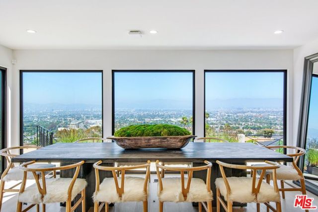 a bedroom with a large bed and a large window