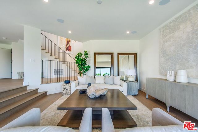 a living room with furniture and a lamp