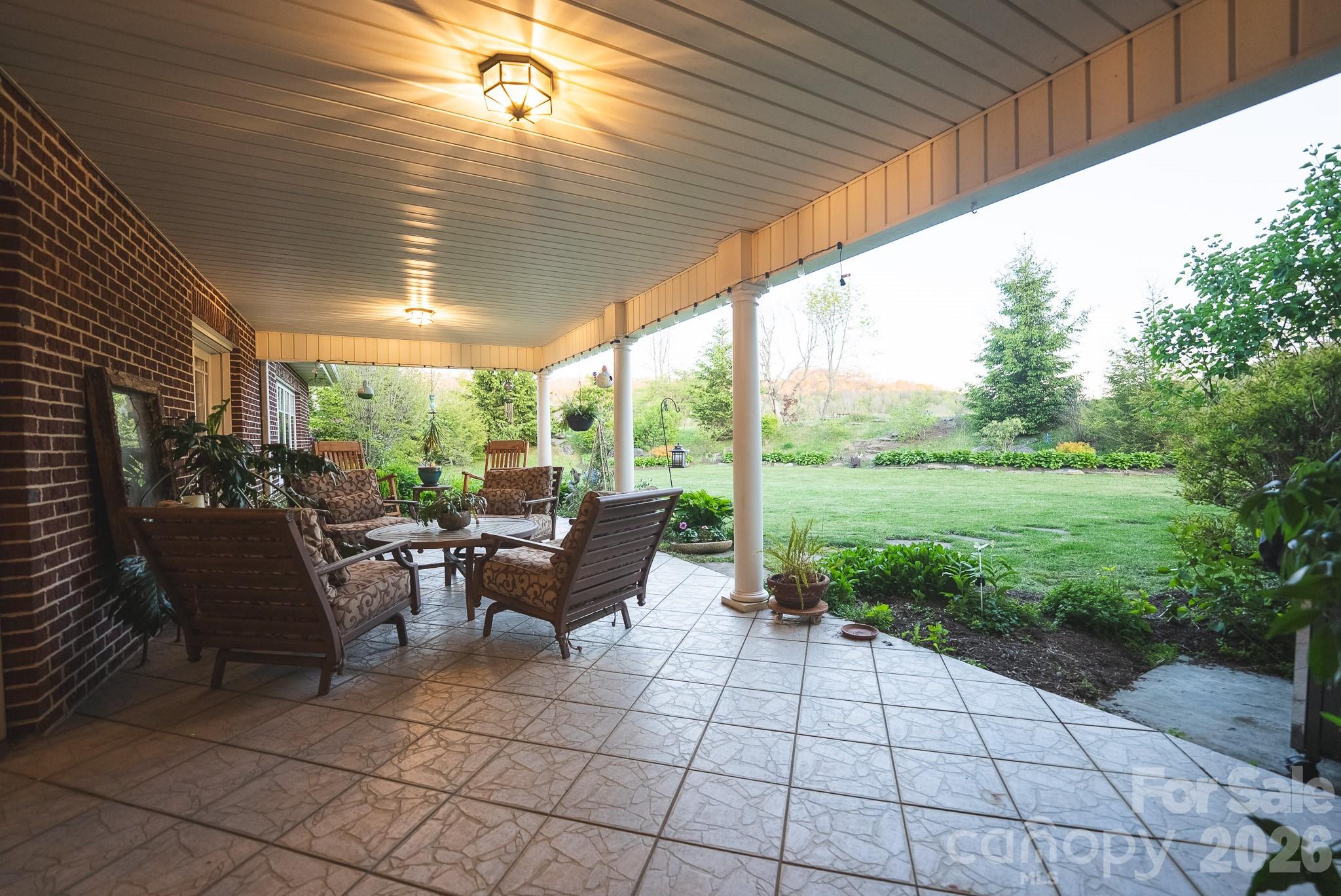 6985 Junaluska Road Boone, NC 28607 - Photo 33 of 35 a view of a patio with chairs and plants